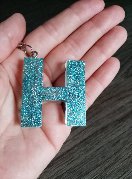 porte clé H bleue