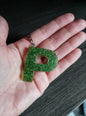 porte clé P vert